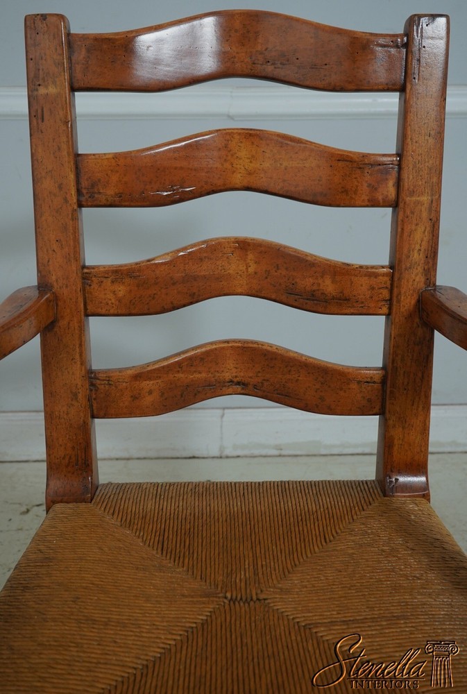 68471: Pair GUY CHADDOCK Distressed Ladderback Armchairs