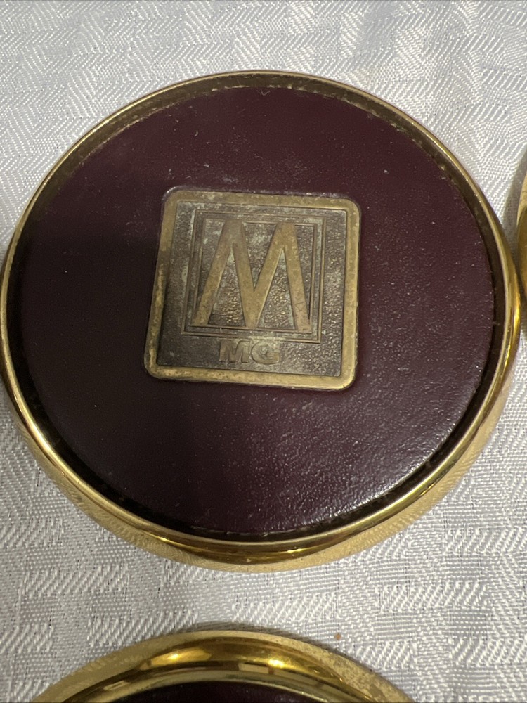 8 Vintage Solid BRASS and Brown LEATHER M MG COASTERS