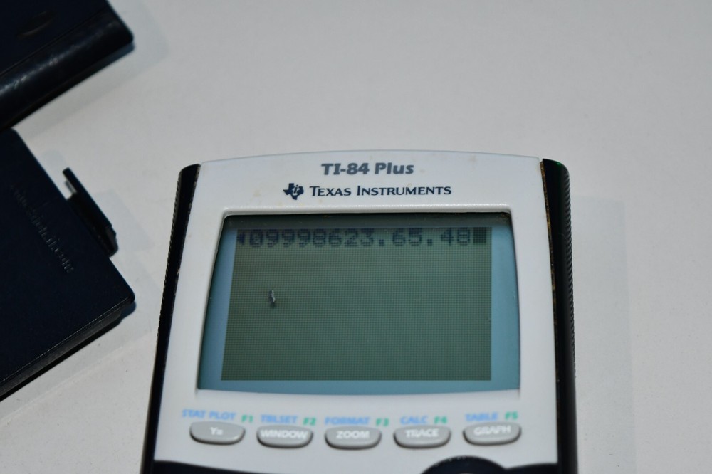 Texas Instruments TI-84 Plus Graphics Calculator with spot on OUTER screen works