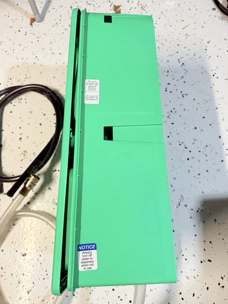 3M Flow Control System chemical dispenser, a wall-mounted.