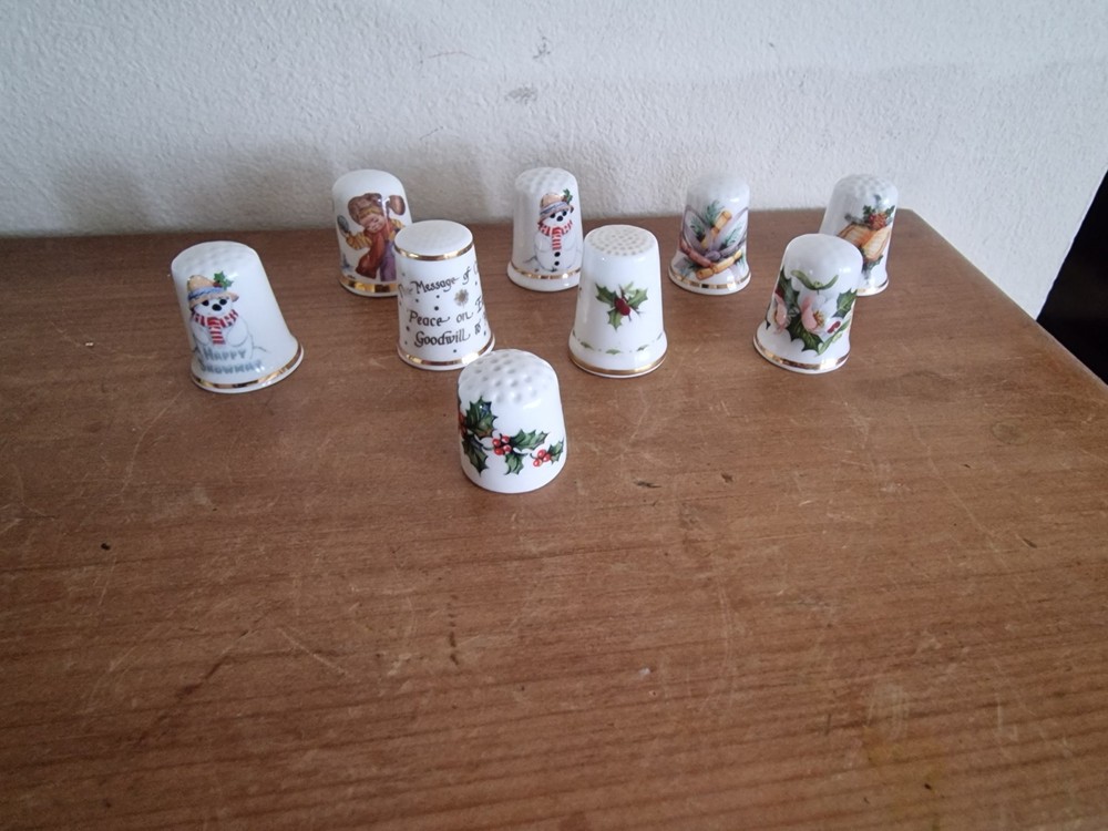 9 x Christmas themed thimbles