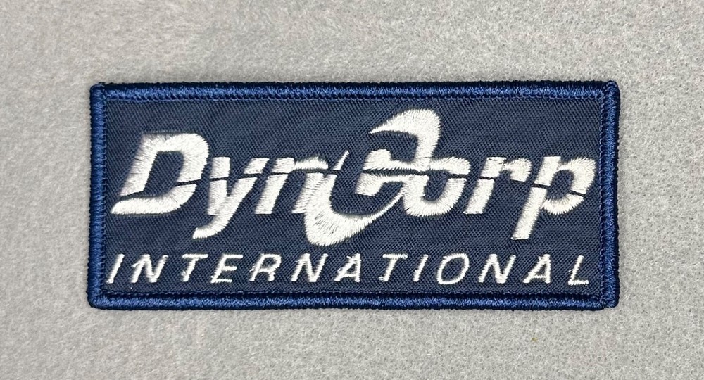 DYNCORP INTERNATIONAL EMBROIDERED IRON-ON PATCH...