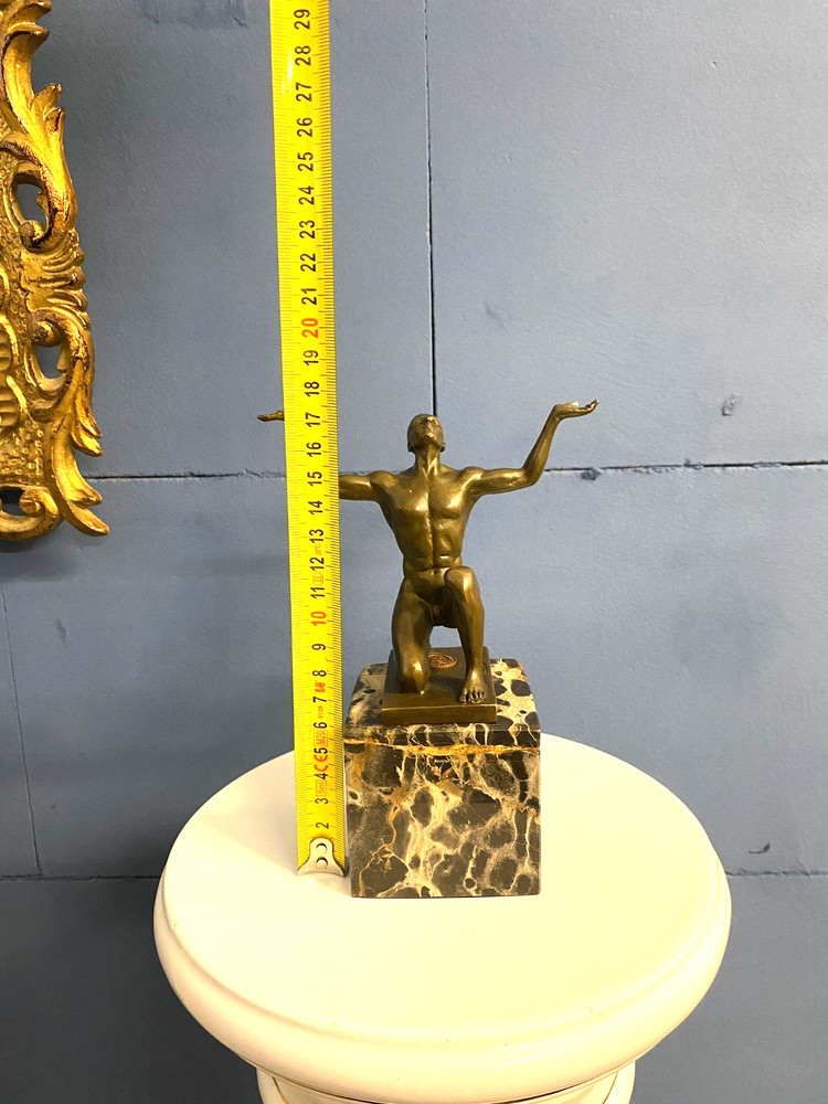 Bronze sculpture kneeling Adonis on black marble base after Cesaro