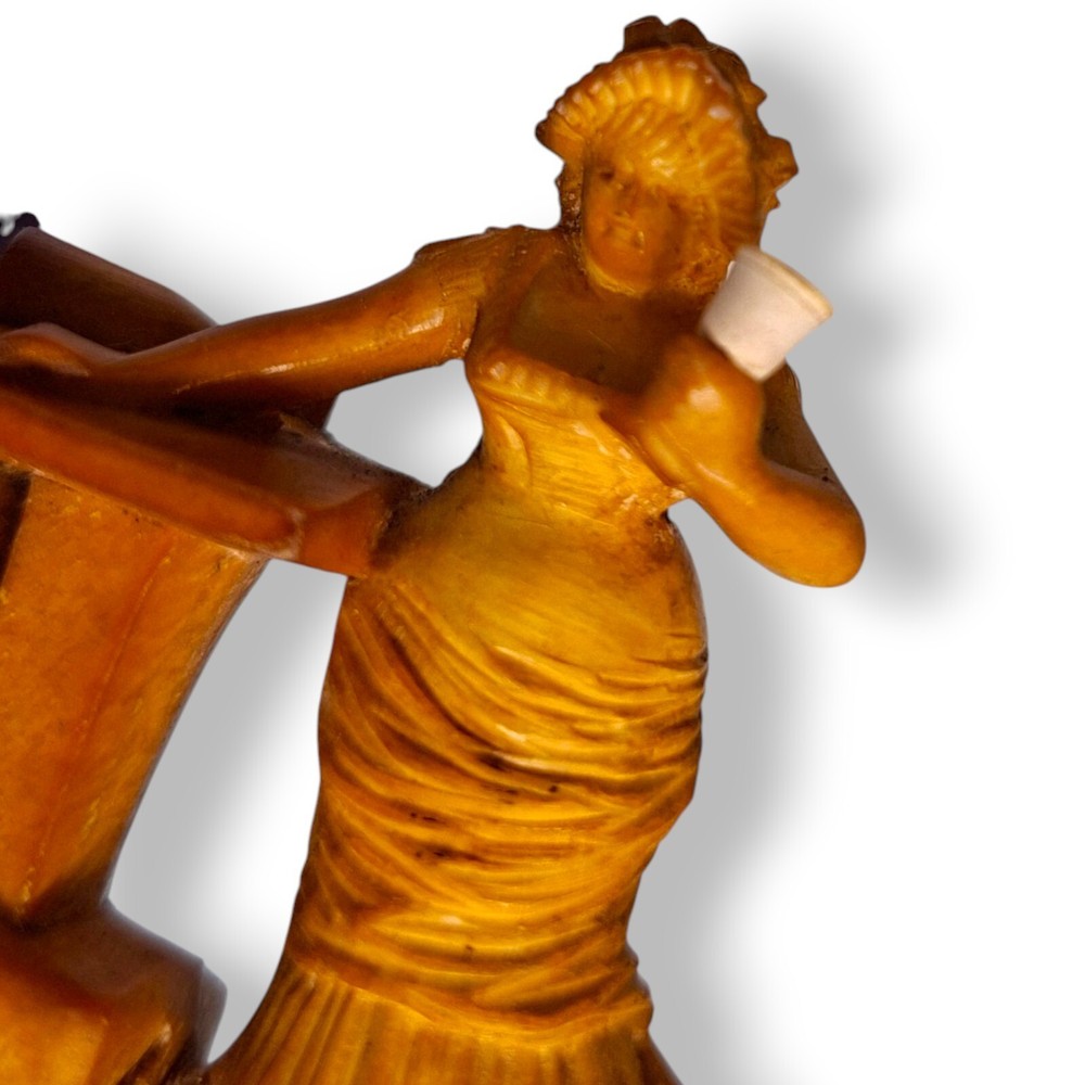 Antique pipe meerschaum lady with a table drinking