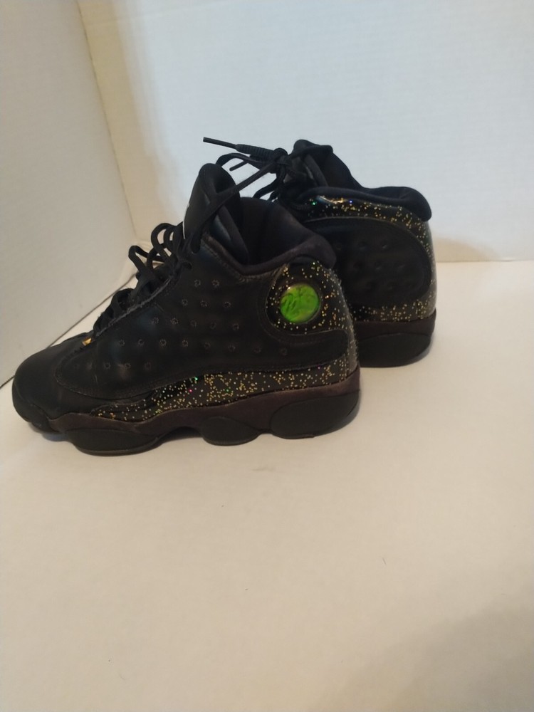 size 4y jordans black with specks design