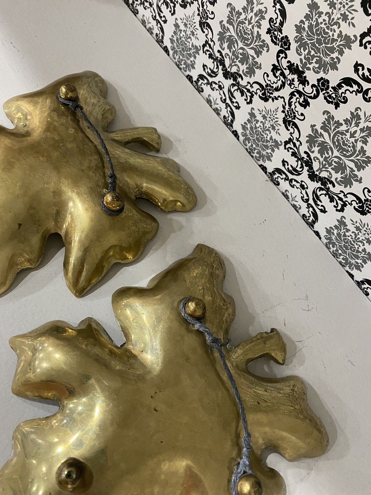 two beautiful solid brass leaf design wall decor. 7 inches tall.