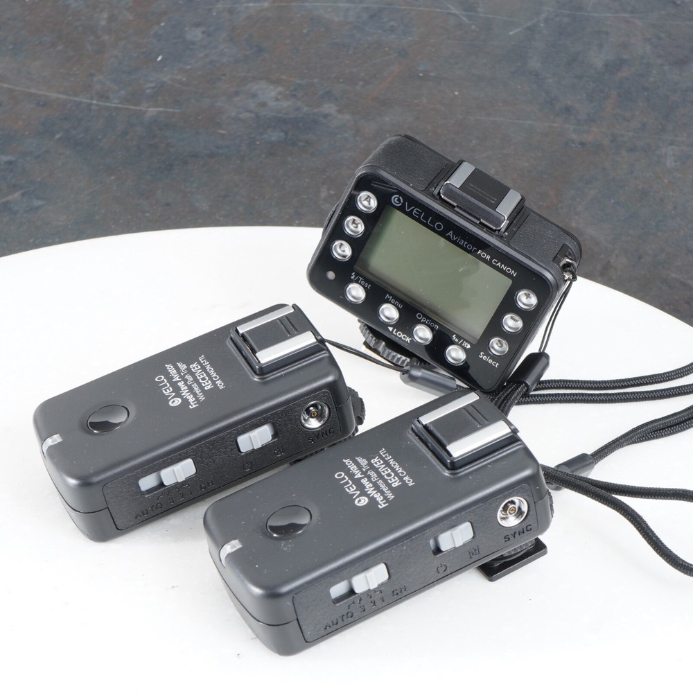 ^ Vello FreeWave Aviator Wireless Flash Trigger Transceiver for Select Canon