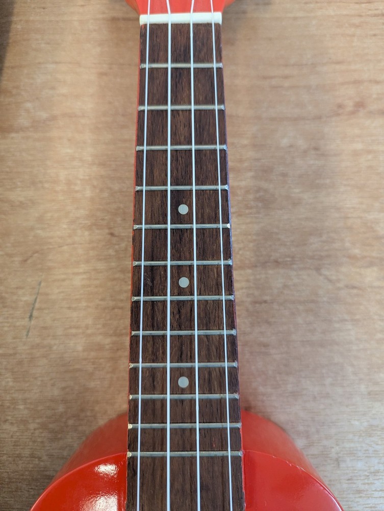 Octopus Soprano Ukulele Red with 4 Strings Includes Case for Beginners