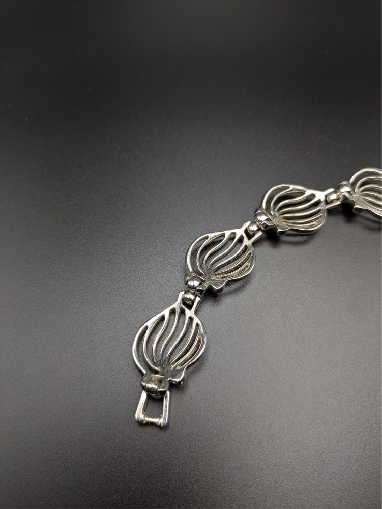 Silver-Toned Bracelet and Necklace Set Featuring Abstract Leaf Patterns