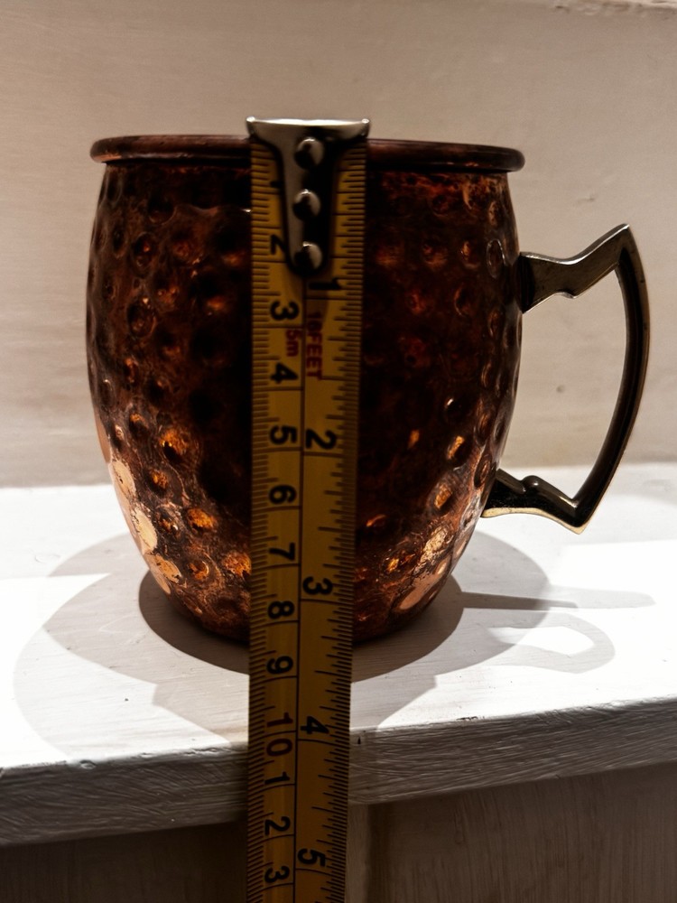 Set of Four Hammered Copper Mugs