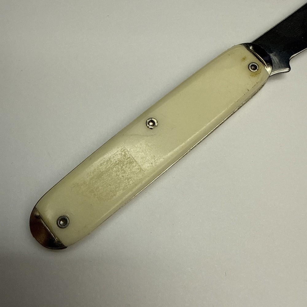 Vintage Seagram's Off-White Plastic Handle Folding Pocket Knife