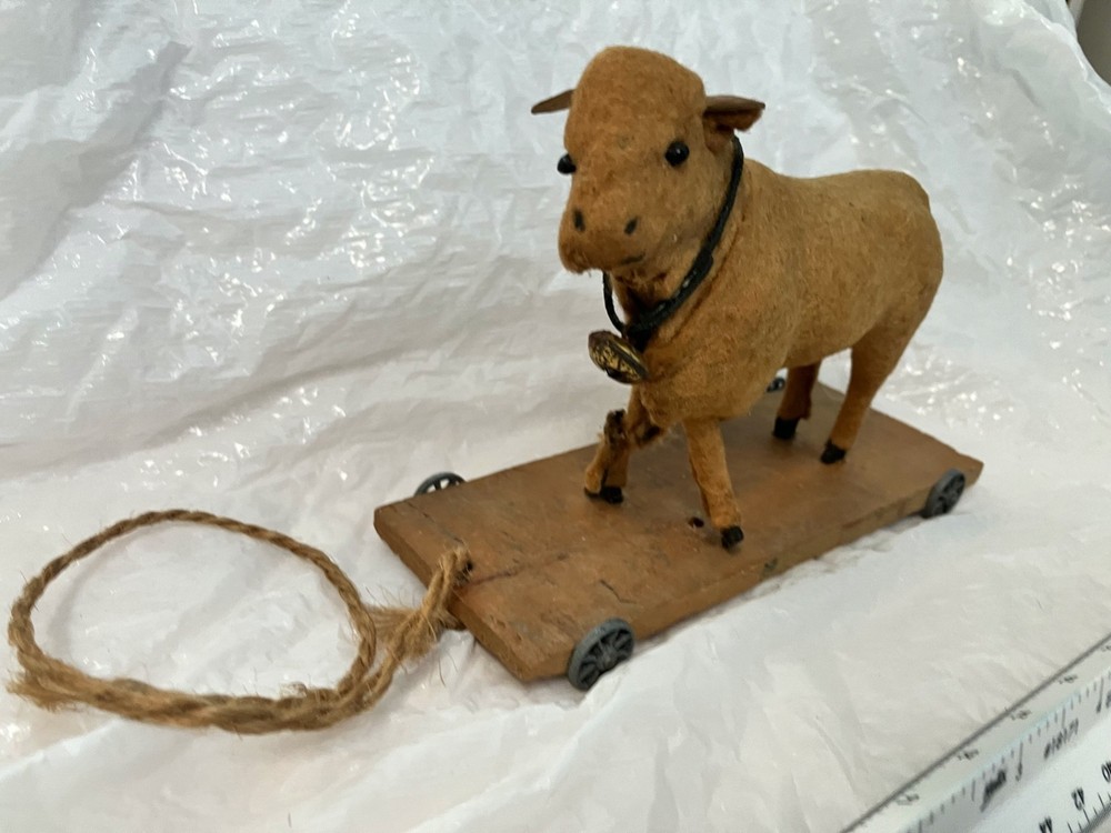 Antique childs felt covered pull toy