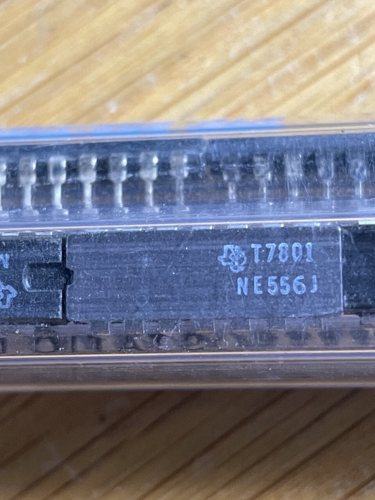 TWO (2) Texas instrument  NE556J timer chips in a CDIP14 package
