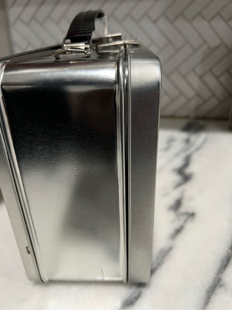 Wing-stop lunch box with drink flask.