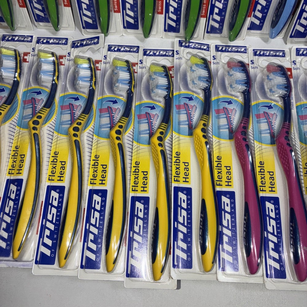 23 Trisa Flexible Head Toothbrushes/ All New