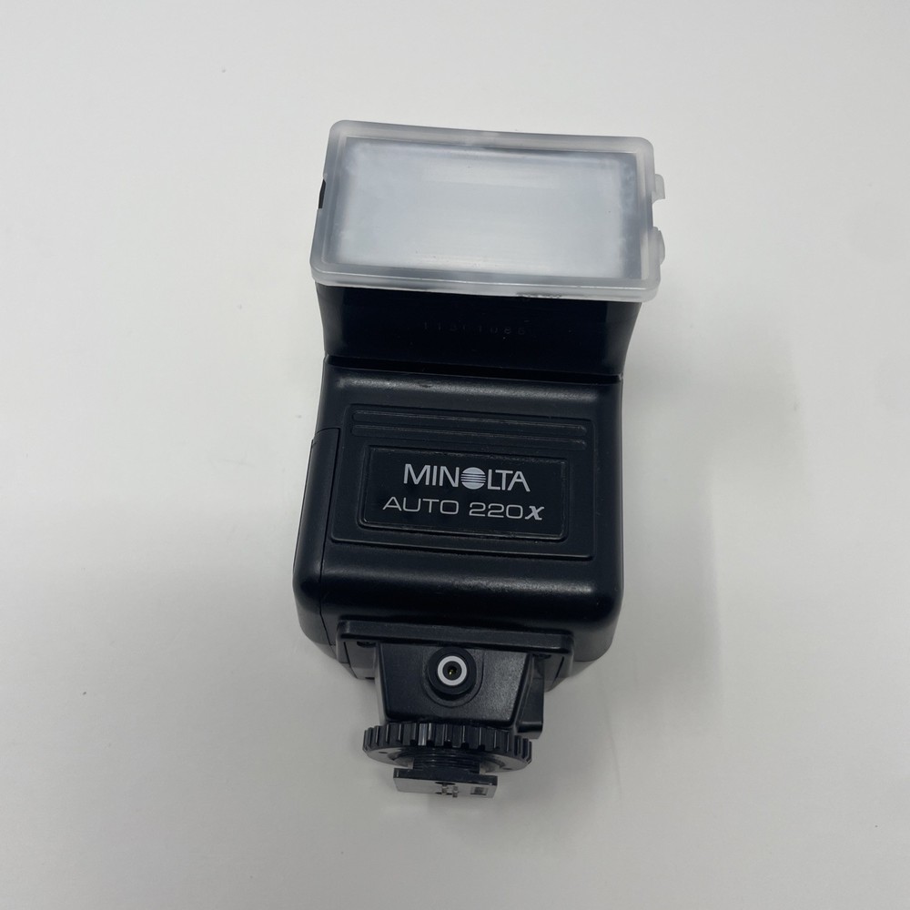 Minolta Auto 220X Universal Shoe Mount Camera Flash With Plastic Cover