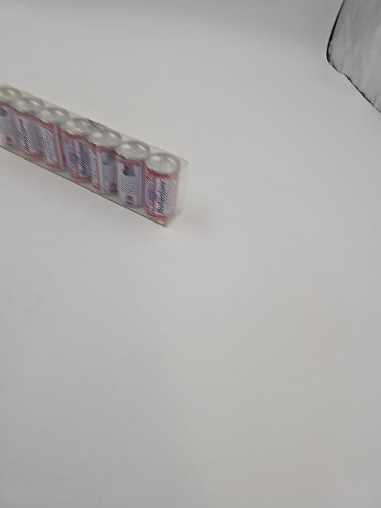 7 Miniture Budweiser cans