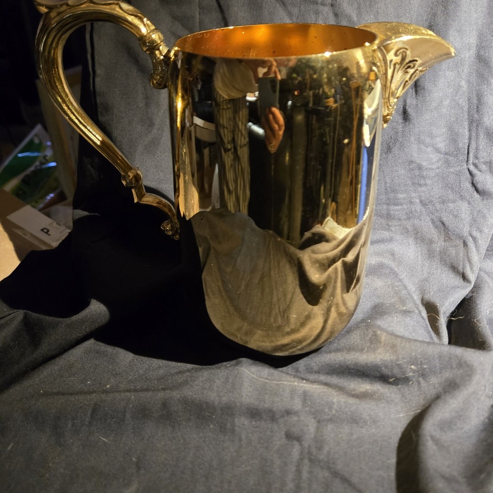 Sheridan silver-plated pitcher with ornate handle and spout