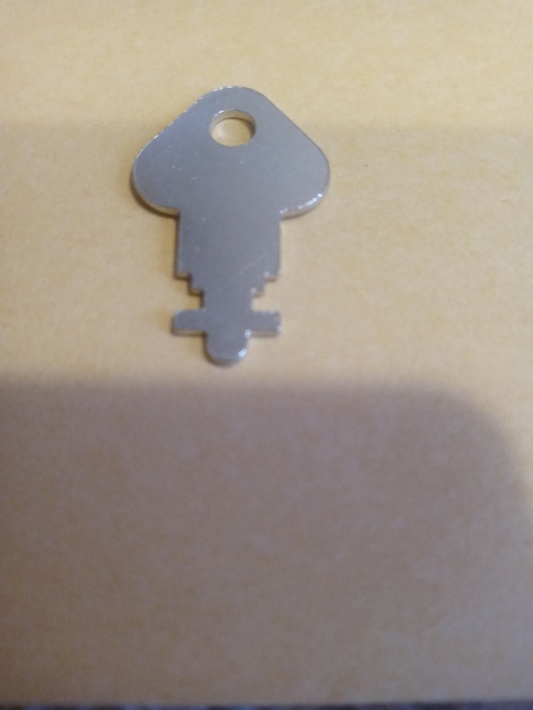 Paper towel dispenser key