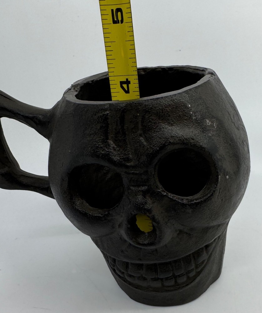 Cast Iron Skull-Shaped Bottomless Mug Thingy With Handle Both Ends And Eyes Open