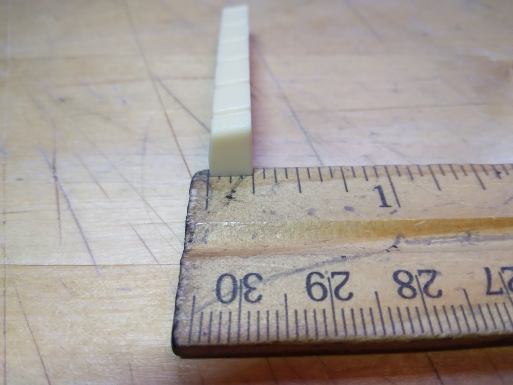 Vintage unbranded Plastic guitar Nut, white