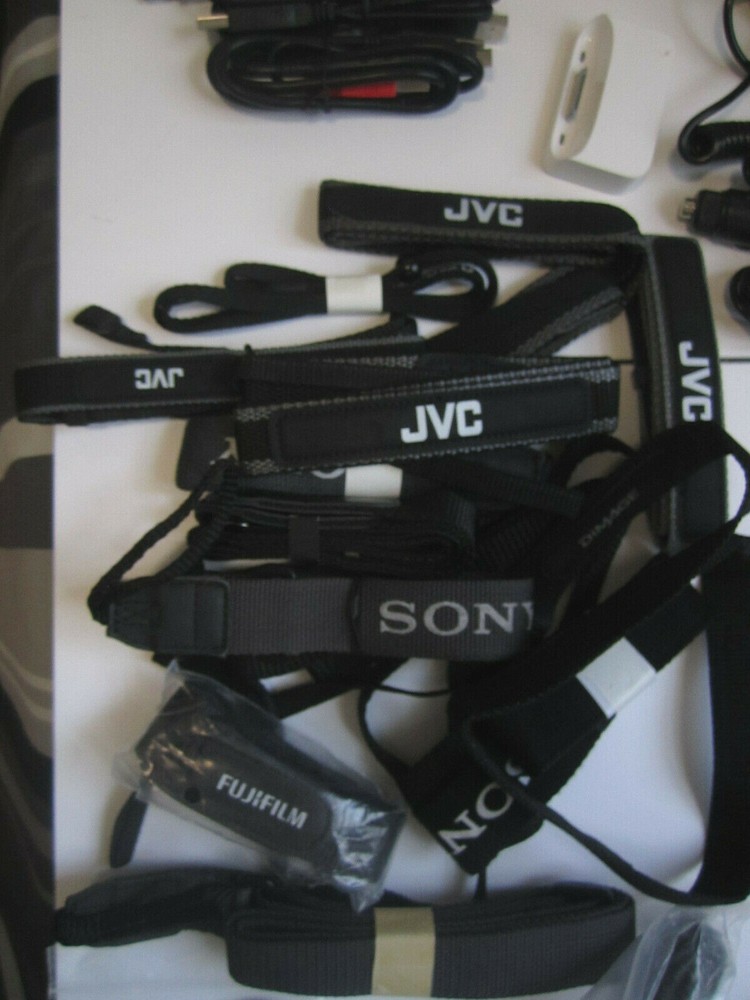 Lot of electronics, Assorted camera straps , Assorted cables and more ZZ