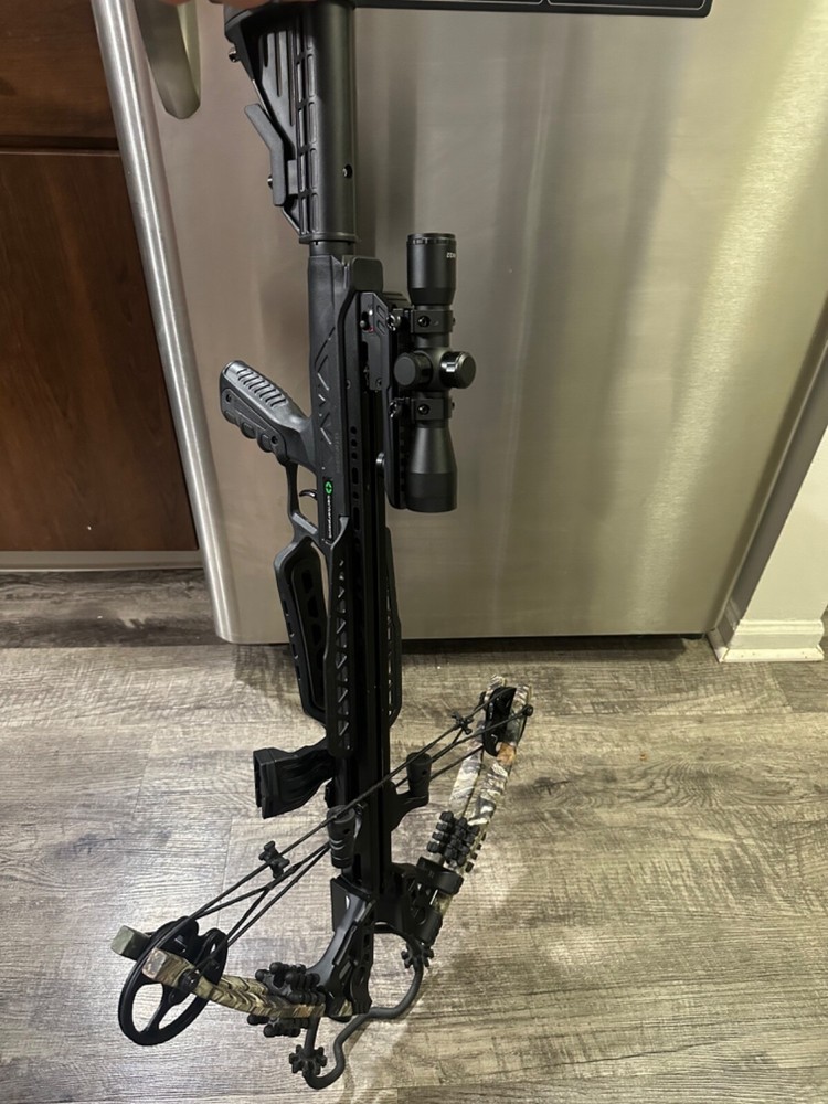 crossbow , with case arrows broadheads and pull cord.