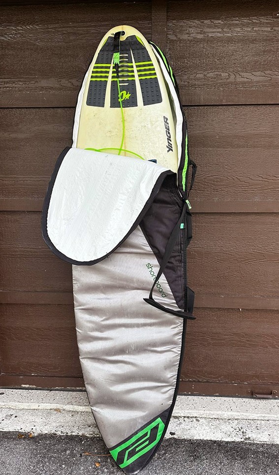 YANCER Surfboard and a cover