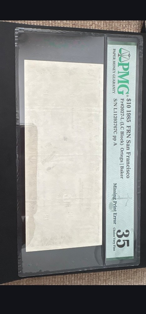 $10 1985 missing print graded 35