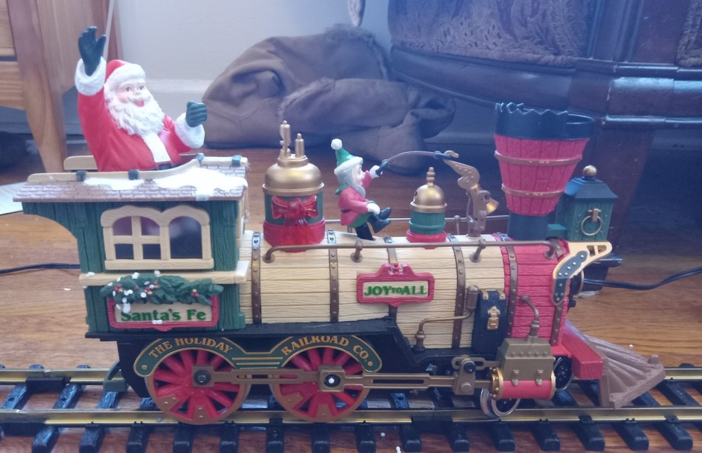 The Holiday Express Animated Train Set. Complete working set plus 2 extra cars.