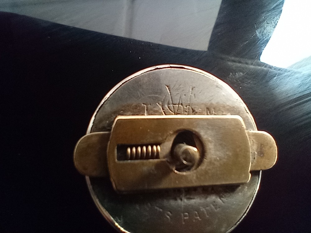 Ornate Victorian silver plated lapel badge