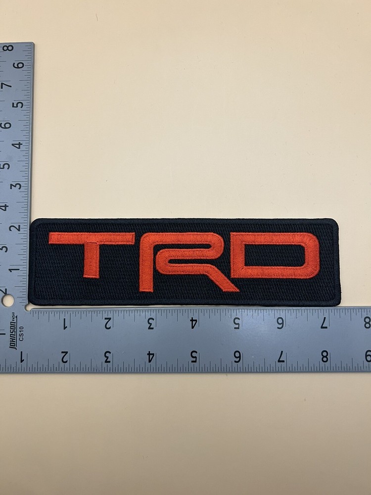 TRD Toyota Racing Development Iron On Patch. 7.25”x2” Solid Red On Black