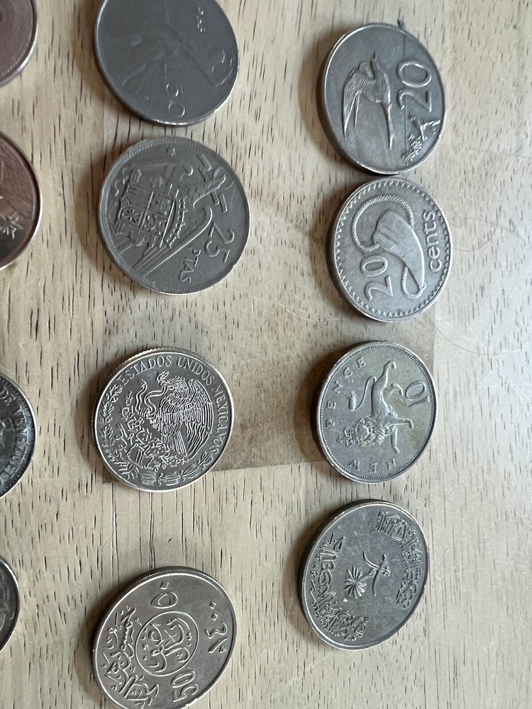 Assorted foreign coins. 26 Coins In Total