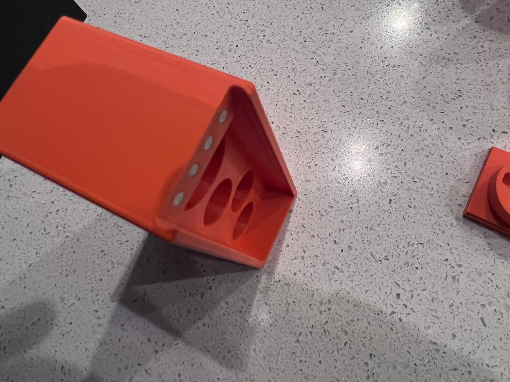 Rugged Obsidian piston/booster storage case and multi-tool