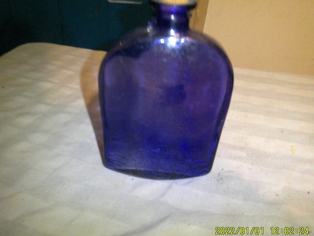 PURPLE GLASS BOTTLE EMBROSSED FANCY PATTERN BASE NOT OLD