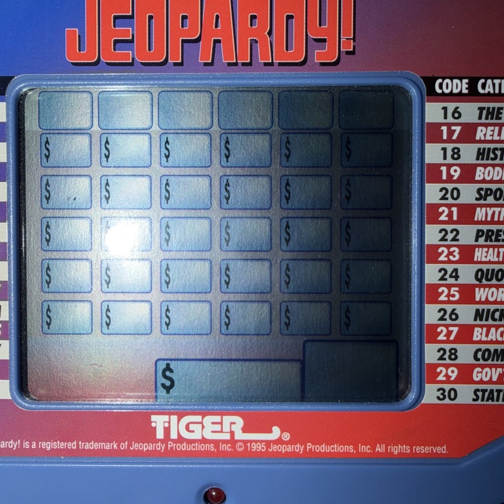 Tiger Electronics Jeopardy Handheld Game With Answer/question Book + Instruction