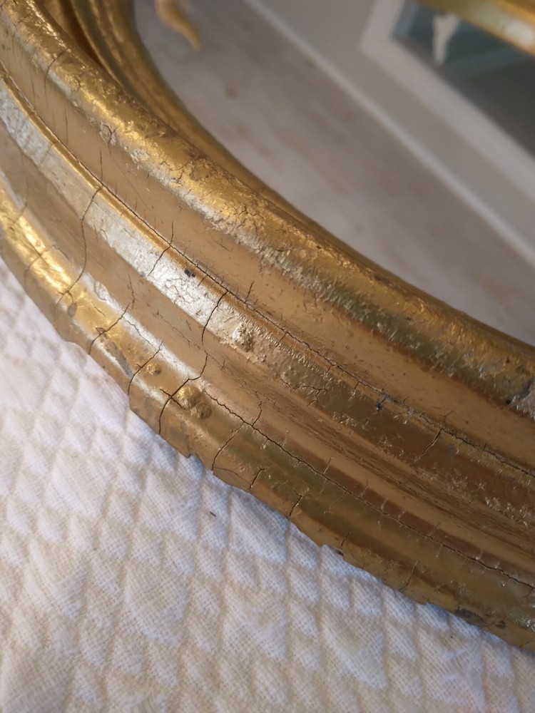 Antique Oval gilt Victorian mirror.
