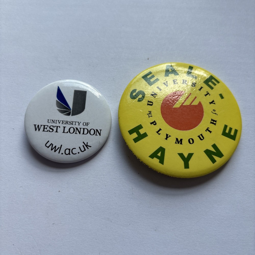Two University Pin Badges.