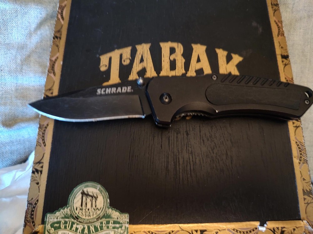 Schrade Folding Pocket Knife with Black Handle