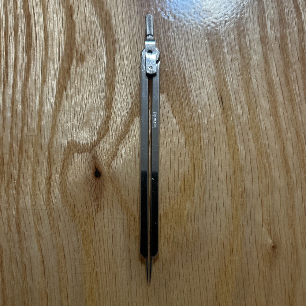 Lot of four drafting compasses