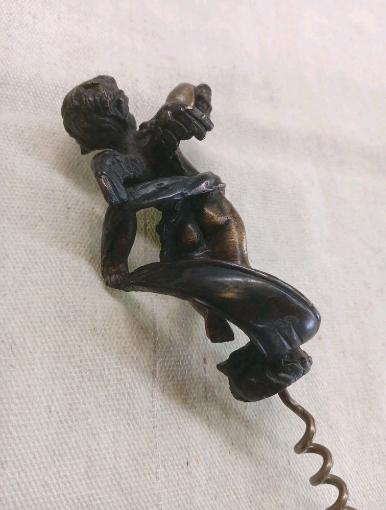 COLLECTABLE BRONZED CORKSCREW WITH WINGED CHERRUB HANDLE