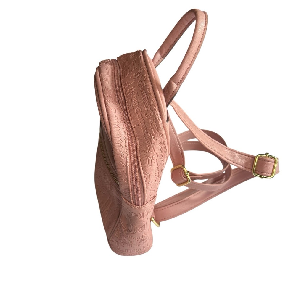 Backpack Elegant Juicy Couture backpack in blush. Embossed logo design. Includes