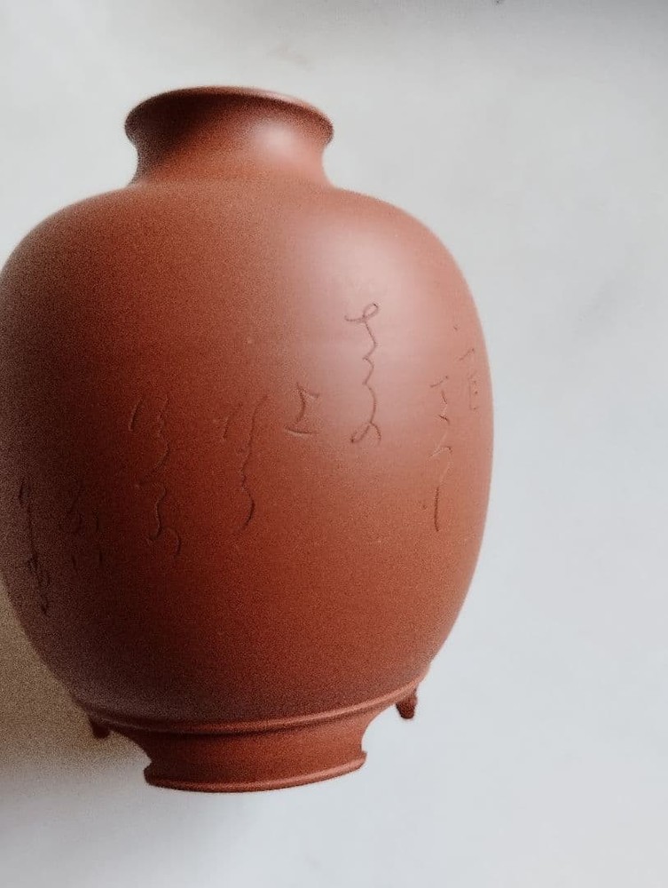 Reddish-brown ceramic sake bottle and 4-piece choko set