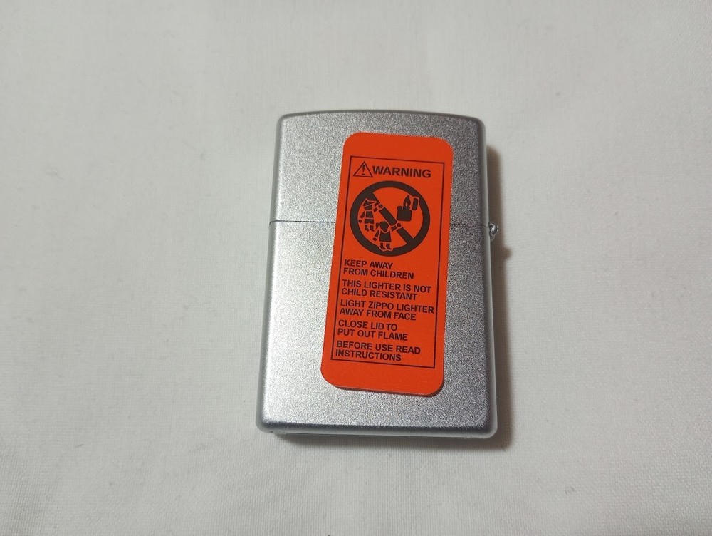 ---New unfired 2005 Zippo DWM monogram engraved lighter