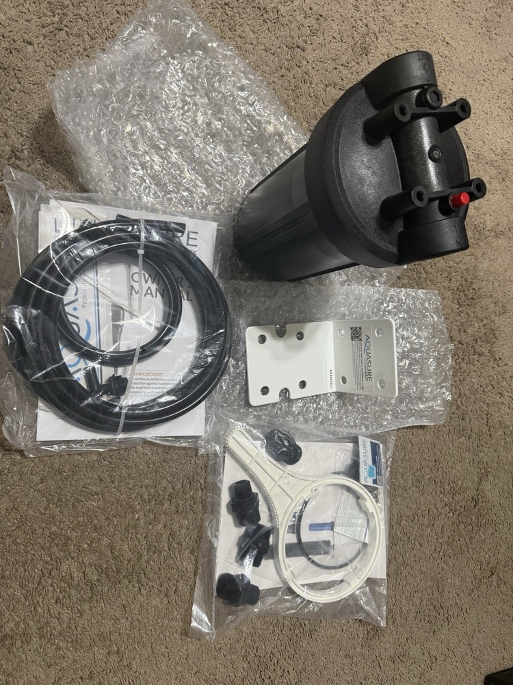 AQUASURE REPLACMENT FILTER CANSITER AND MOUNTING BRACKET AND HOSE TOOLS ETC.