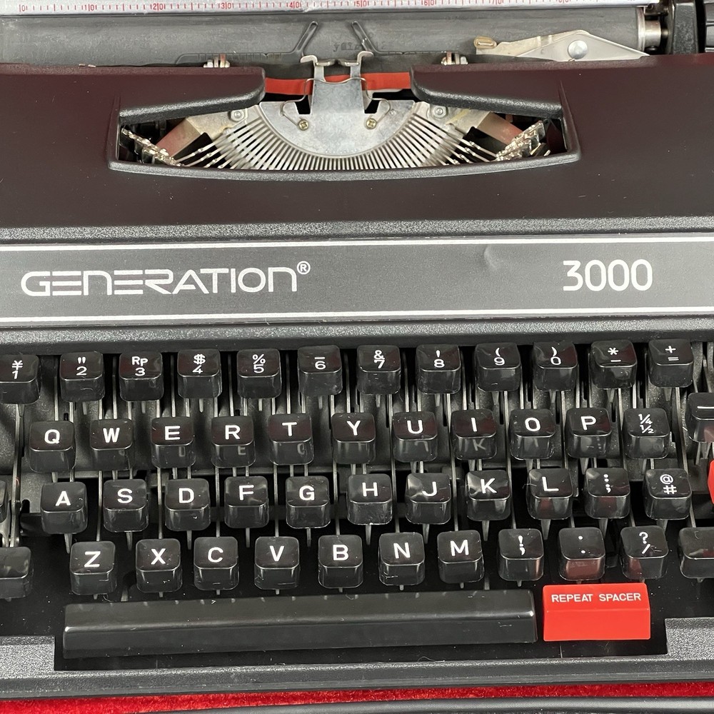 Generation 3000 Manual Typewriter with Case and Paperwork