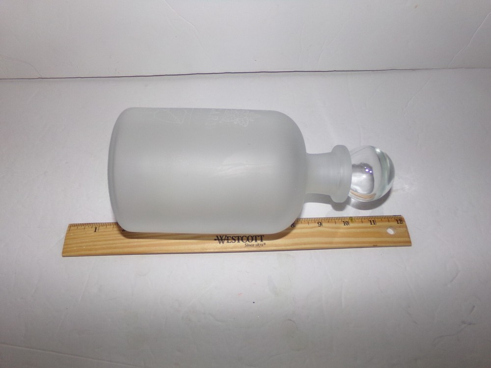 FLOSTED GLASS BOTTLE WITH STOPPER HAS WORDS ETCHED