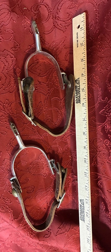 Western horse spurs with leather boot straps