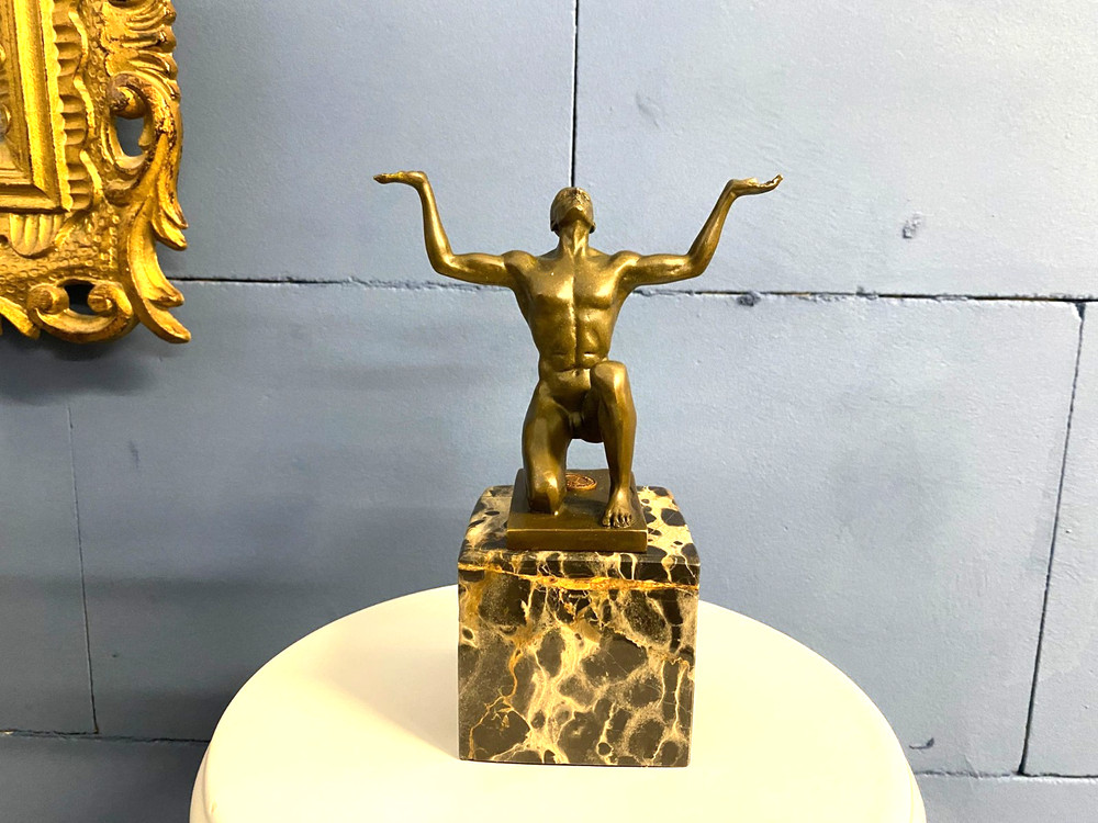 Bronze sculpture kneeling Adonis on black marble base after Cesaro