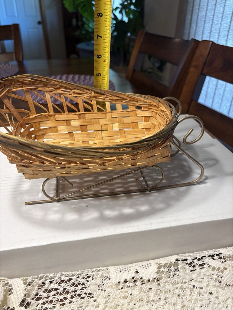 Wicker sleigh basket and white Doily